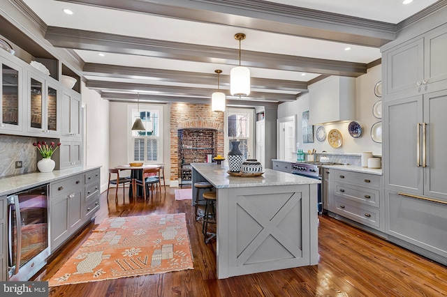 kitchen with wine cooler, stainless steel range, gray cabinetry, beamed ceiling, and wall chimney exhaust hood