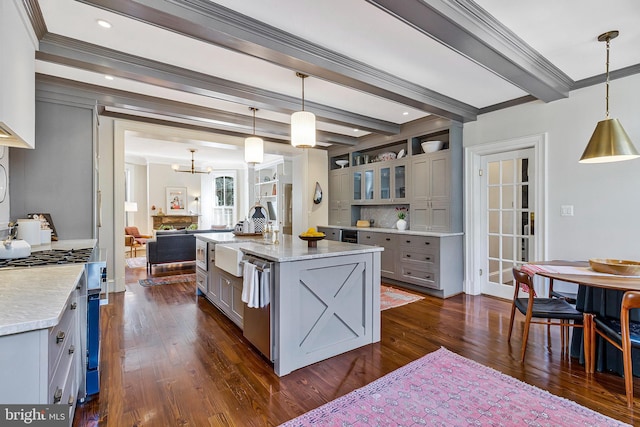 kitchen with ornamental molding, dark wood-style flooring, beamed ceiling, gray cabinetry, and a sink