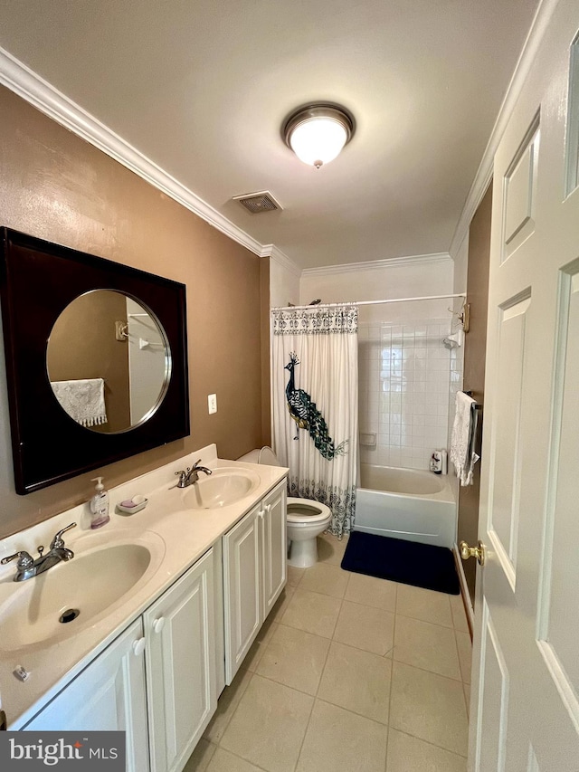 bathroom featuring tile patterned flooring, crown molding, and a sink