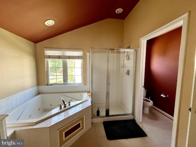 bathroom with toilet, a stall shower, vaulted ceiling, and a jetted tub