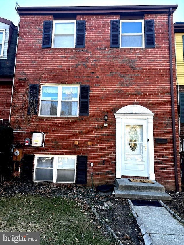 view of front of property featuring brick siding