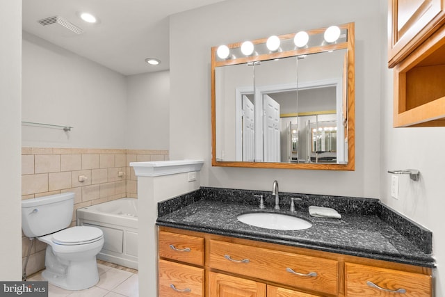 full bathroom with tile walls, tile patterned floors, visible vents, toilet, and a bath