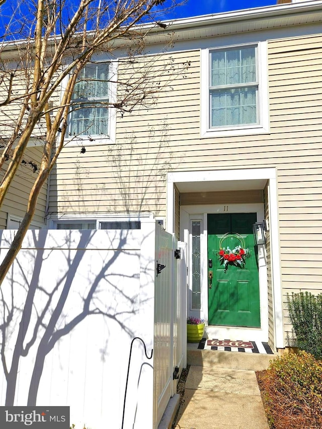 property entrance with a gate and fence