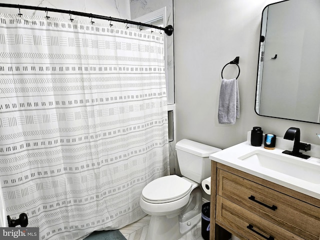 bathroom with vanity, toilet, and a shower with curtain