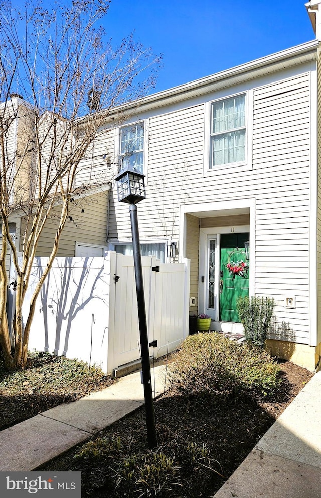 view of front of home featuring a gate and fence