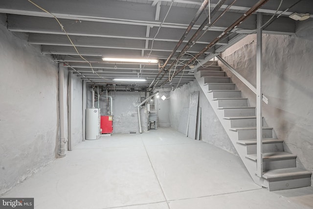 unfinished below grade area with water heater and stairs