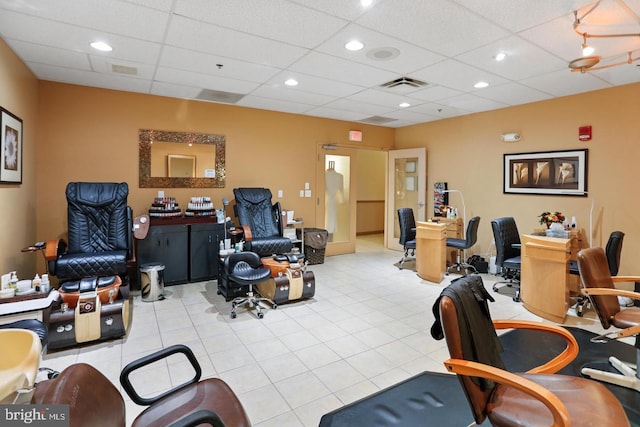 office space featuring light tile patterned floors, a paneled ceiling, visible vents, and recessed lighting