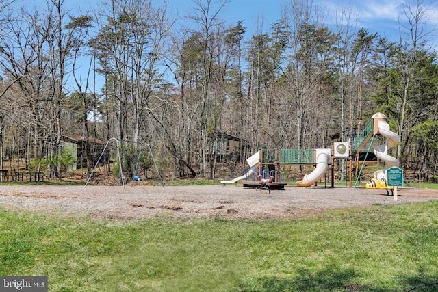 community jungle gym with a yard