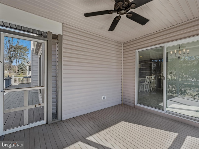 wooden terrace featuring ceiling fan