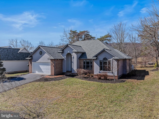 ranch-style home featuring brick siding, roof with shingles, concrete driveway, a garage, and a front lawn