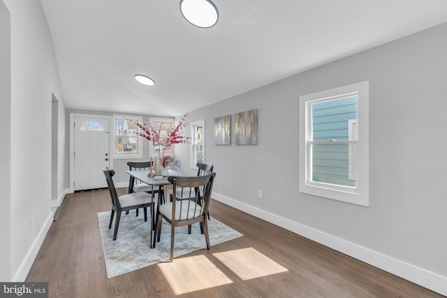 dining area featuring wood finished floors and baseboards