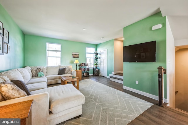 living room featuring baseboards and wood finished floors