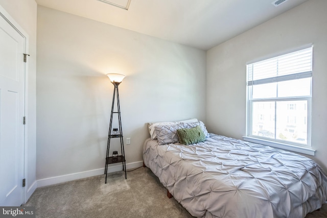 bedroom with visible vents, baseboards, and carpet