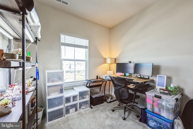 office space featuring carpet flooring and visible vents