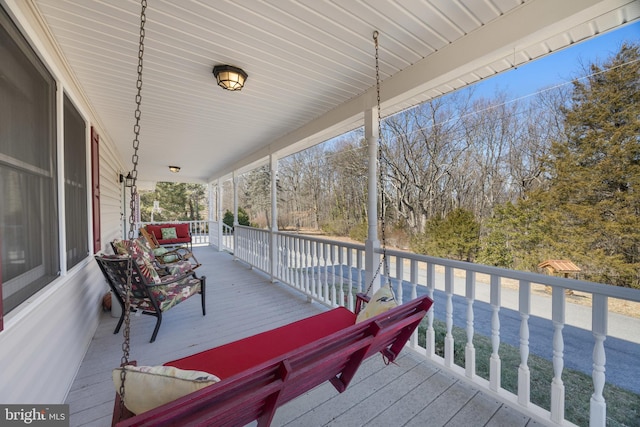 wooden terrace featuring a porch