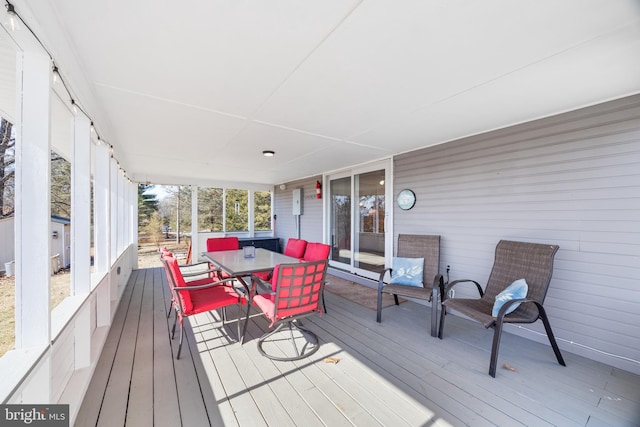 wooden deck featuring outdoor dining space