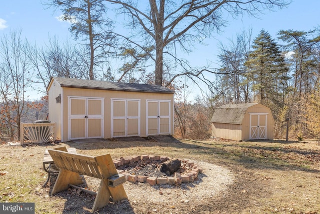 view of shed with a fire pit