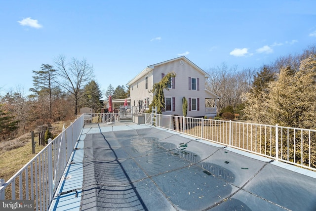 view of pool featuring fence