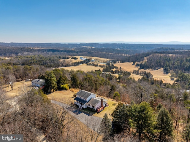 drone / aerial view with a rural view and a wooded view