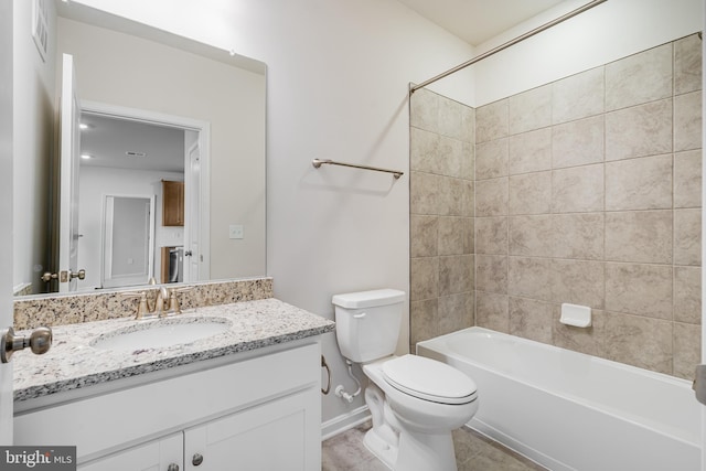 full bathroom with visible vents, toilet, vanity,  shower combination, and tile patterned floors