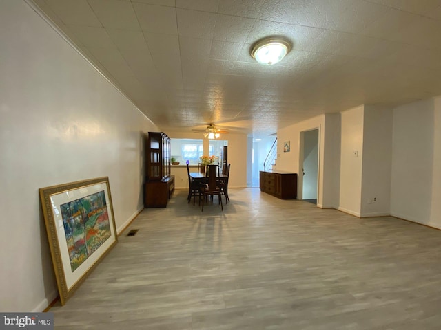 dining area featuring baseboards, visible vents, and wood finished floors