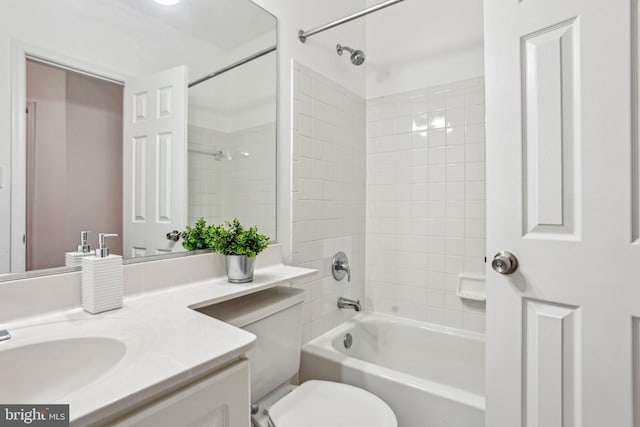 full bathroom featuring toilet, tub / shower combination, and vanity