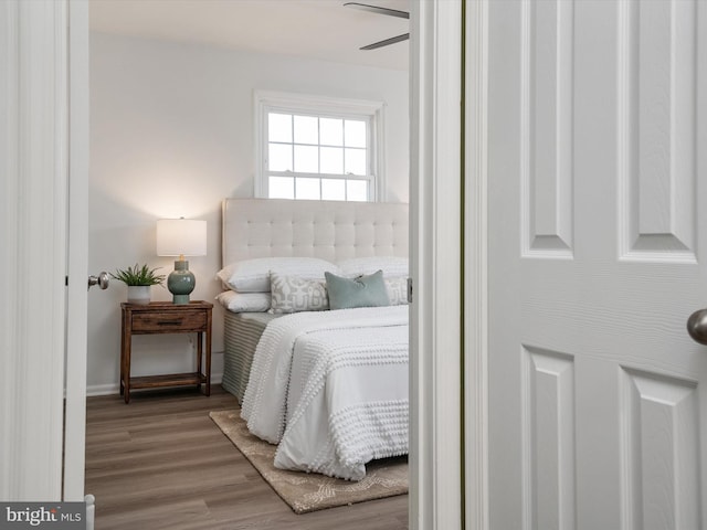 bedroom with wood finished floors