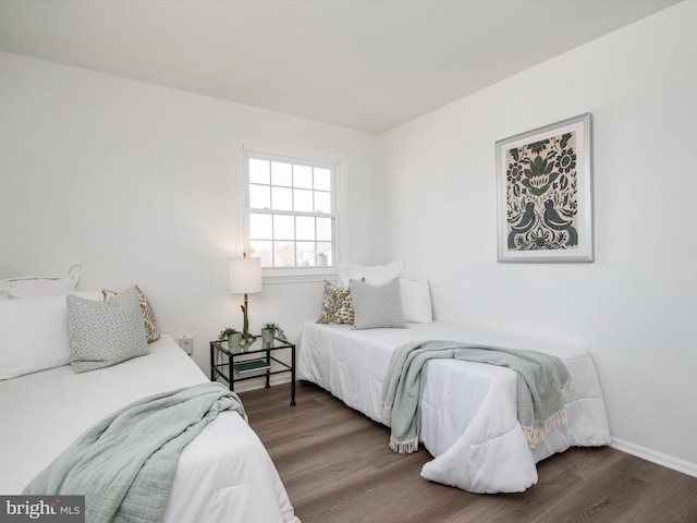 bedroom with wood finished floors