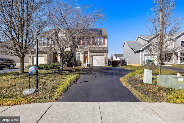 view of front facade with an attached garage and driveway