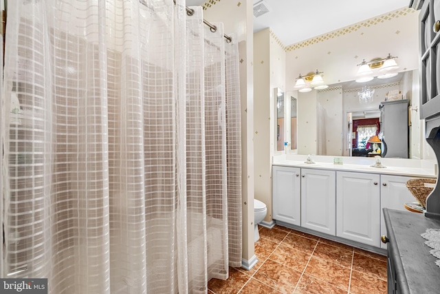 full bath featuring vanity, a shower with curtain, visible vents, tile patterned flooring, and toilet