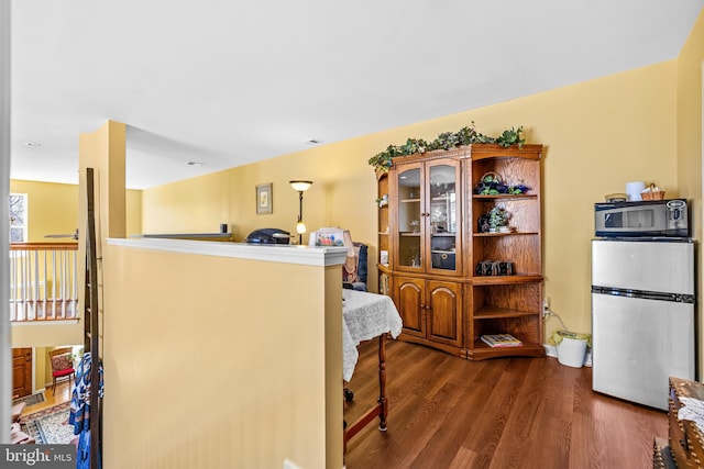 dining area with wood finished floors