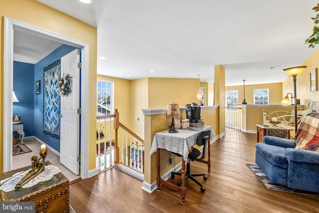 office space featuring recessed lighting, wood finished floors, and baseboards