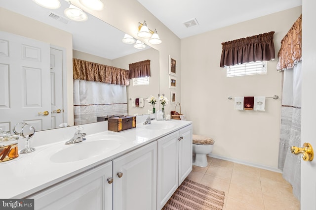 full bathroom featuring tile patterned floors, visible vents, and a sink