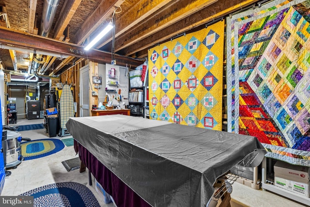 game room with billiards and unfinished concrete flooring