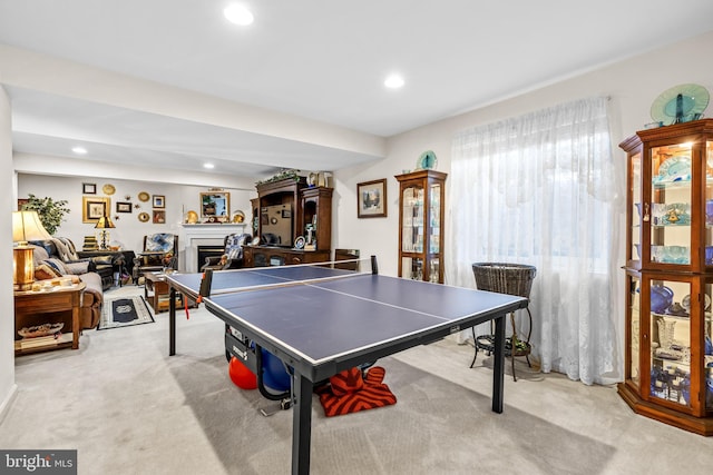 game room featuring recessed lighting, carpet floors, and a fireplace