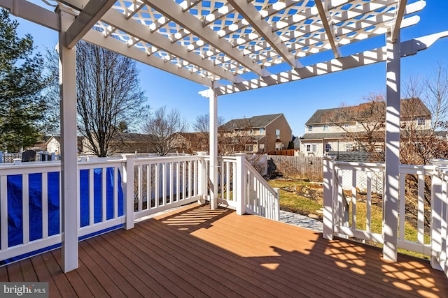 deck with a residential view, fence, and a pergola