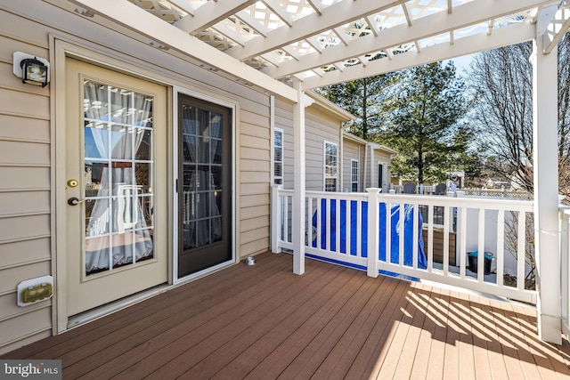 wooden terrace with a pergola