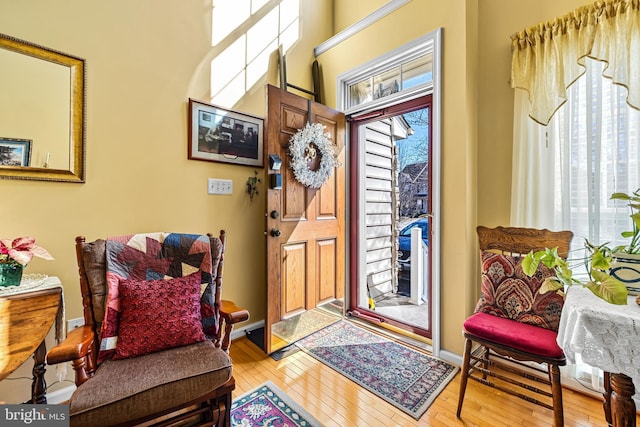 entrance foyer with light wood finished floors and baseboards