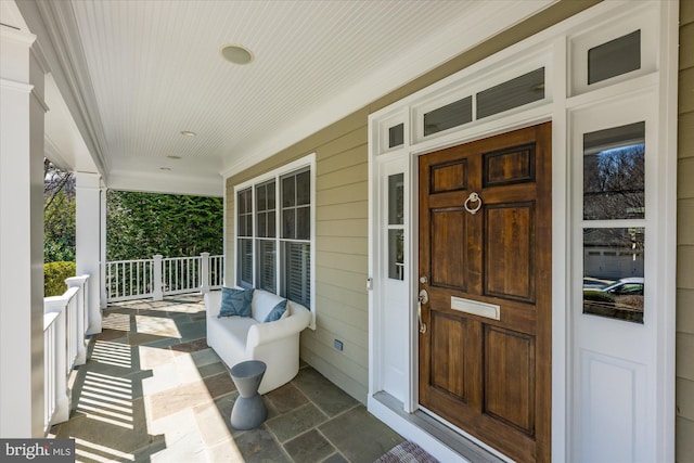 doorway to property with covered porch