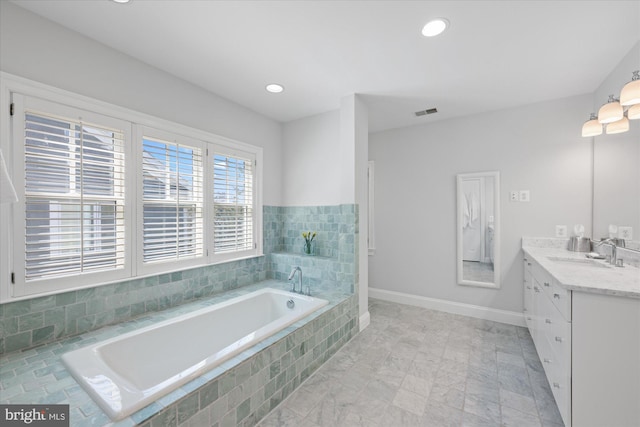 full bathroom with visible vents, baseboards, recessed lighting, a bath, and vanity