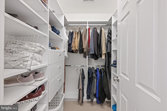 spacious closet featuring visible vents