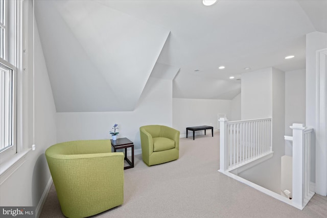 sitting room with an upstairs landing, recessed lighting, carpet flooring, baseboards, and vaulted ceiling