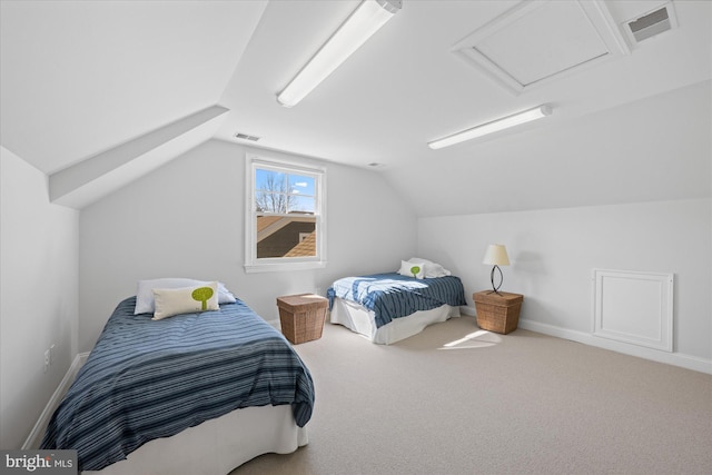 carpeted bedroom with baseboards, visible vents, attic access, and lofted ceiling