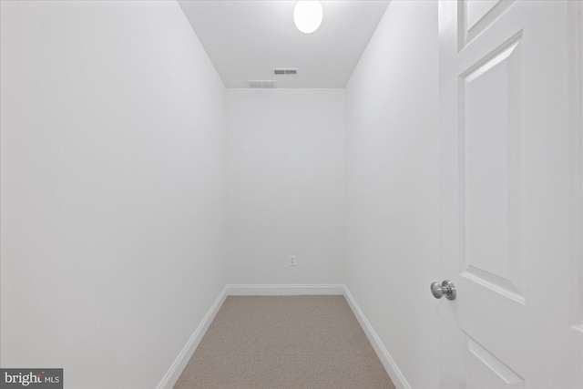 interior space with visible vents, baseboards, and carpet flooring