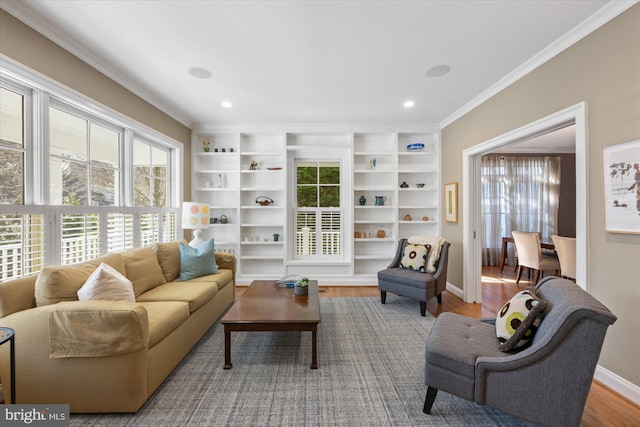 living area with recessed lighting, ornamental molding, baseboards, and wood finished floors