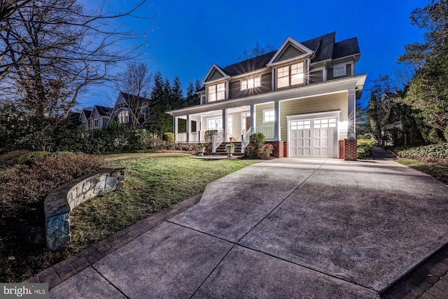 view of front of house with a porch, concrete driveway, and a front lawn