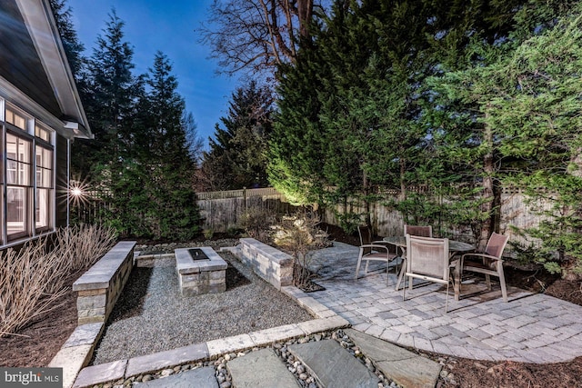 view of patio featuring outdoor dining area and a fenced backyard