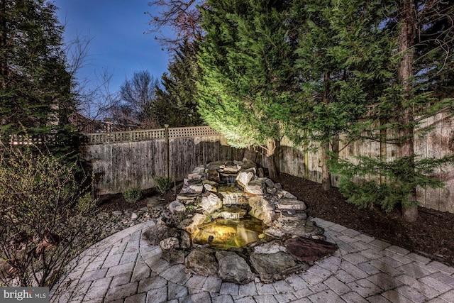 view of yard with a patio and a fenced backyard