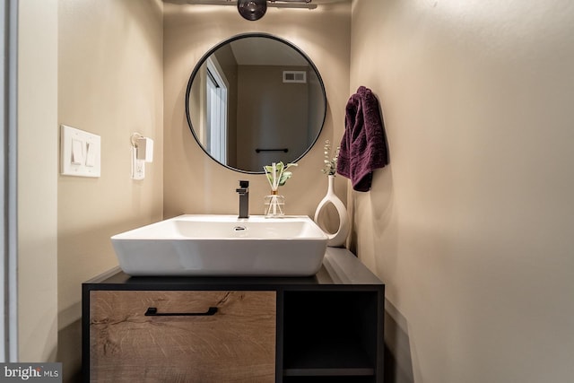 bathroom with a sink and visible vents