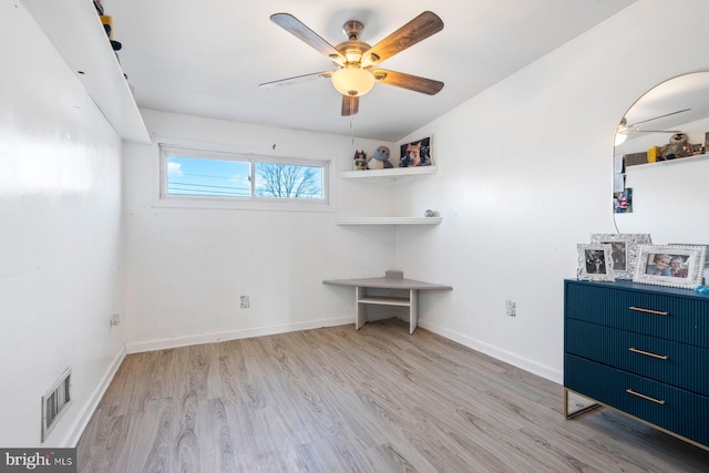 unfurnished bedroom with baseboards, visible vents, ceiling fan, and wood finished floors